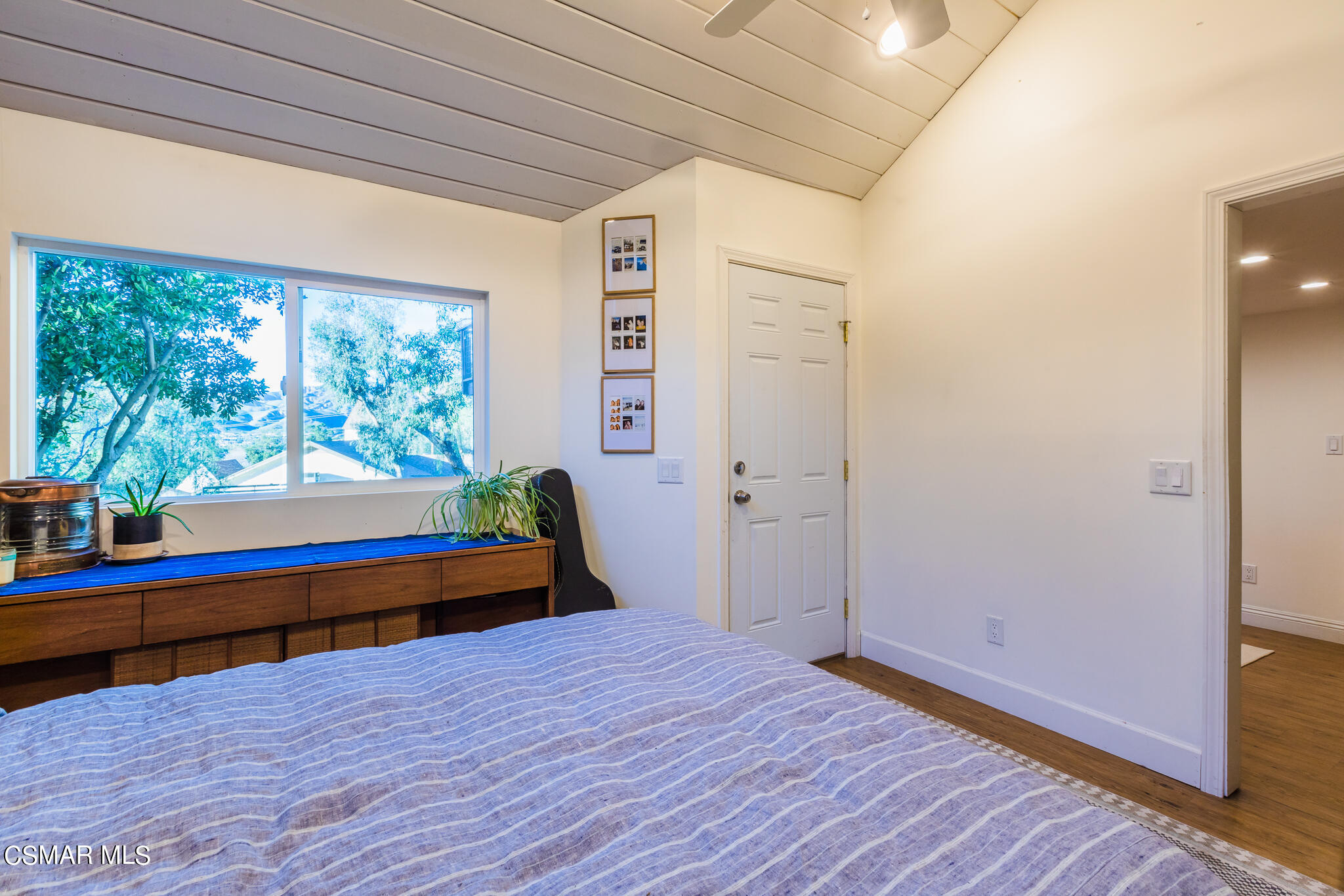 6695 Clear Springs Road Simi Valley, CA 93063 - Photo 35 of 94 a bedroom with wooden floor and a bed