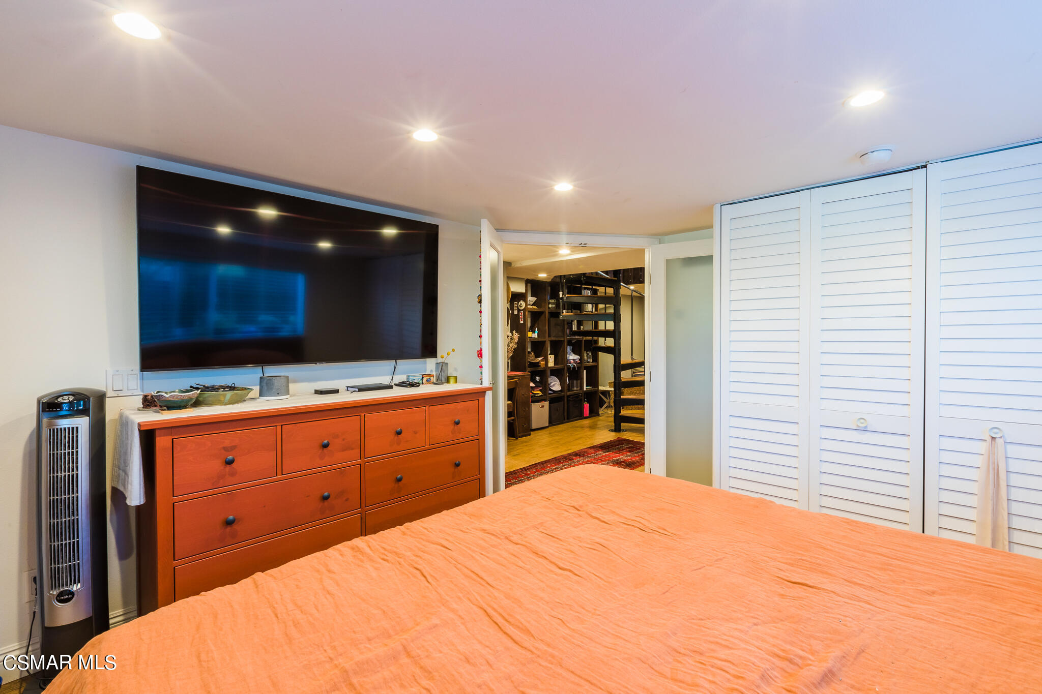 6695 Clear Springs Road Simi Valley, CA 93063 - Photo 41 of 94 a room with a bed and a flat screen tv in it