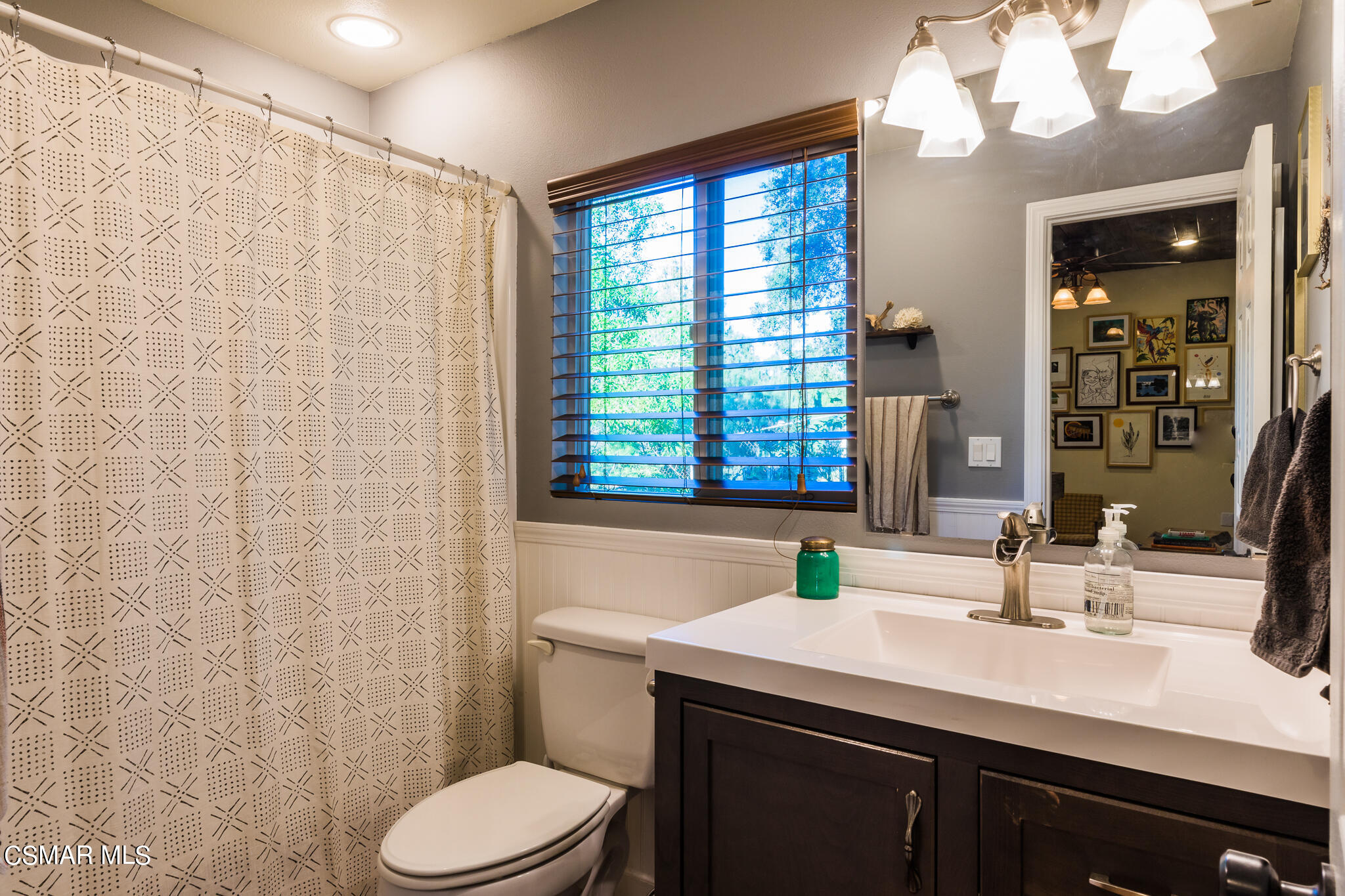 6695 Clear Springs Road Simi Valley, CA 93063 - Photo 47 of 94 a bathroom with a sink a toilet and a mirror