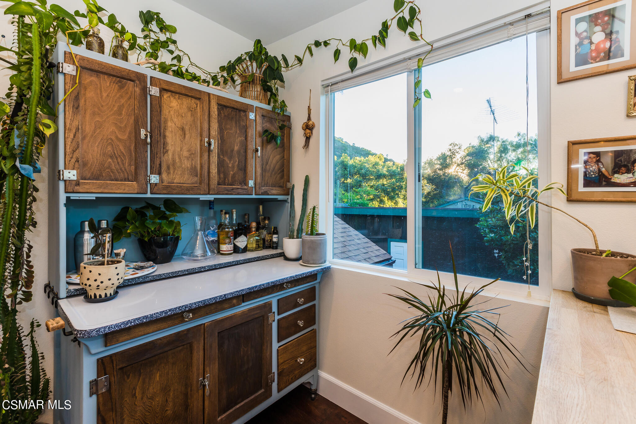 6695 Clear Springs Road Simi Valley, CA 93063 - Photo 57 of 94 a kitchen with a refrigerator and a potted plant