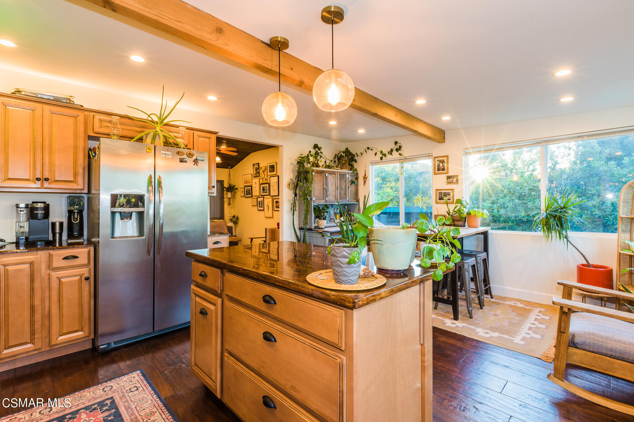 6695 Clear Springs Road Simi Valley, CA 93063 - Photo 65 of 94 a kitchen with stainless steel appliances kitchen island granite countertop a refrigerator a stove and a wooden floors