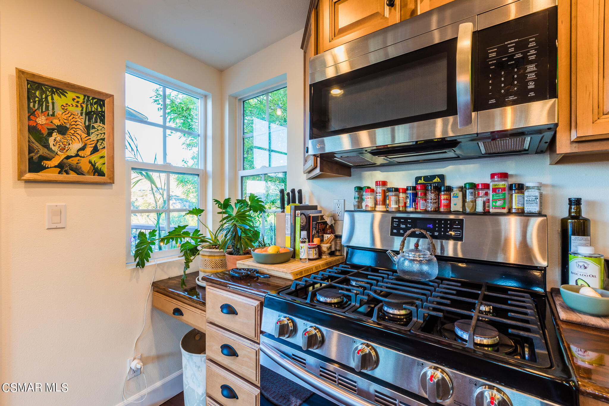 6695 Clear Springs Road Simi Valley, CA 93063 - Photo 67 of 94 a table and chairs in a kitchen next to a window