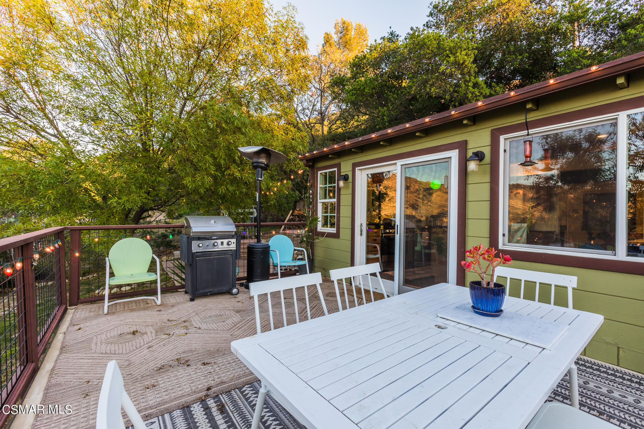 6695 Clear Springs Road Simi Valley, CA 93063 - Photo 70 of 94 a view of a patio with table and chairs with wooden floor and fence