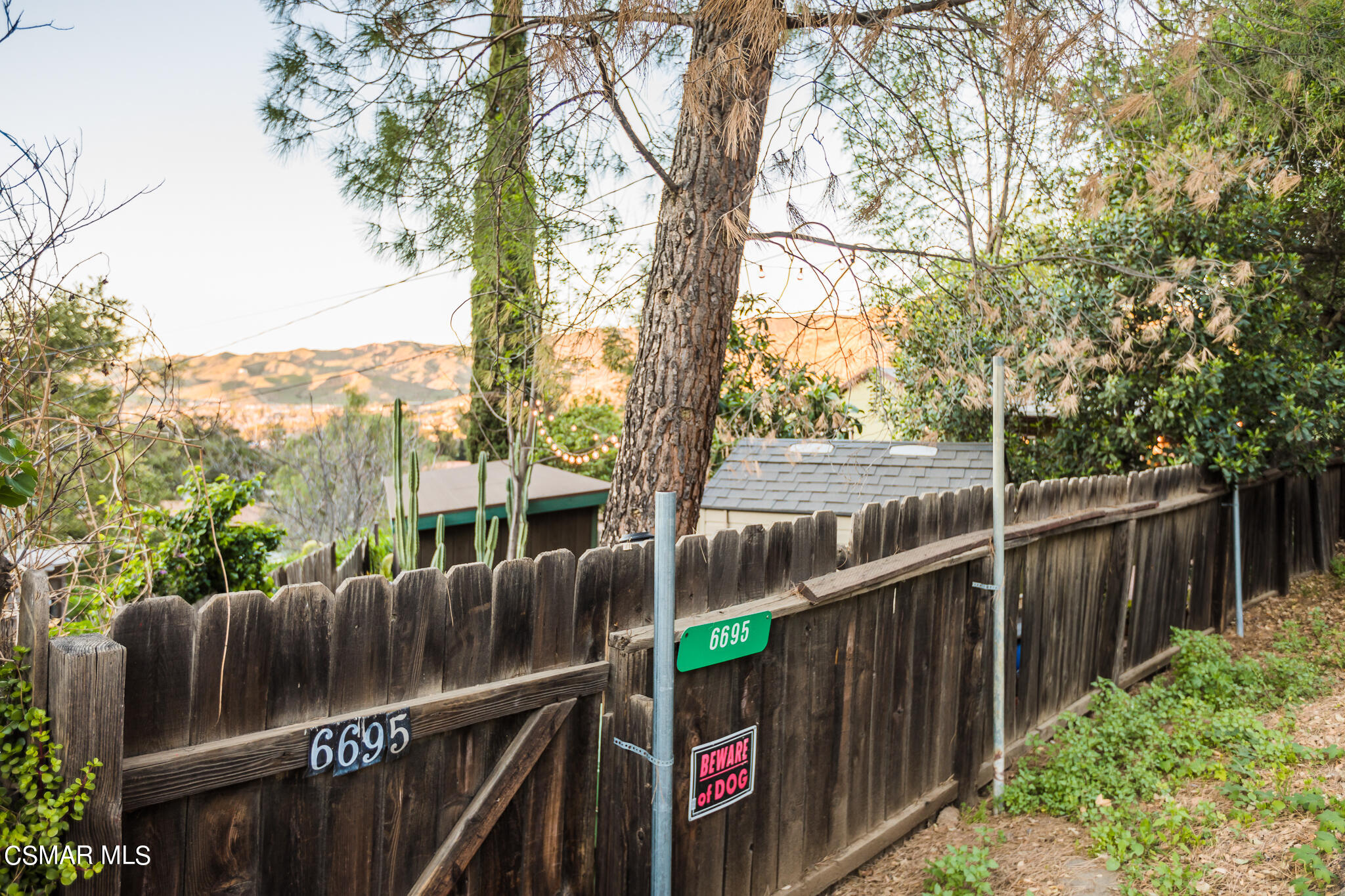 6695 Clear Springs Road Simi Valley, CA 93063 - Photo 79 of 94 a view of a deck with wooden floor and fence next to a yard