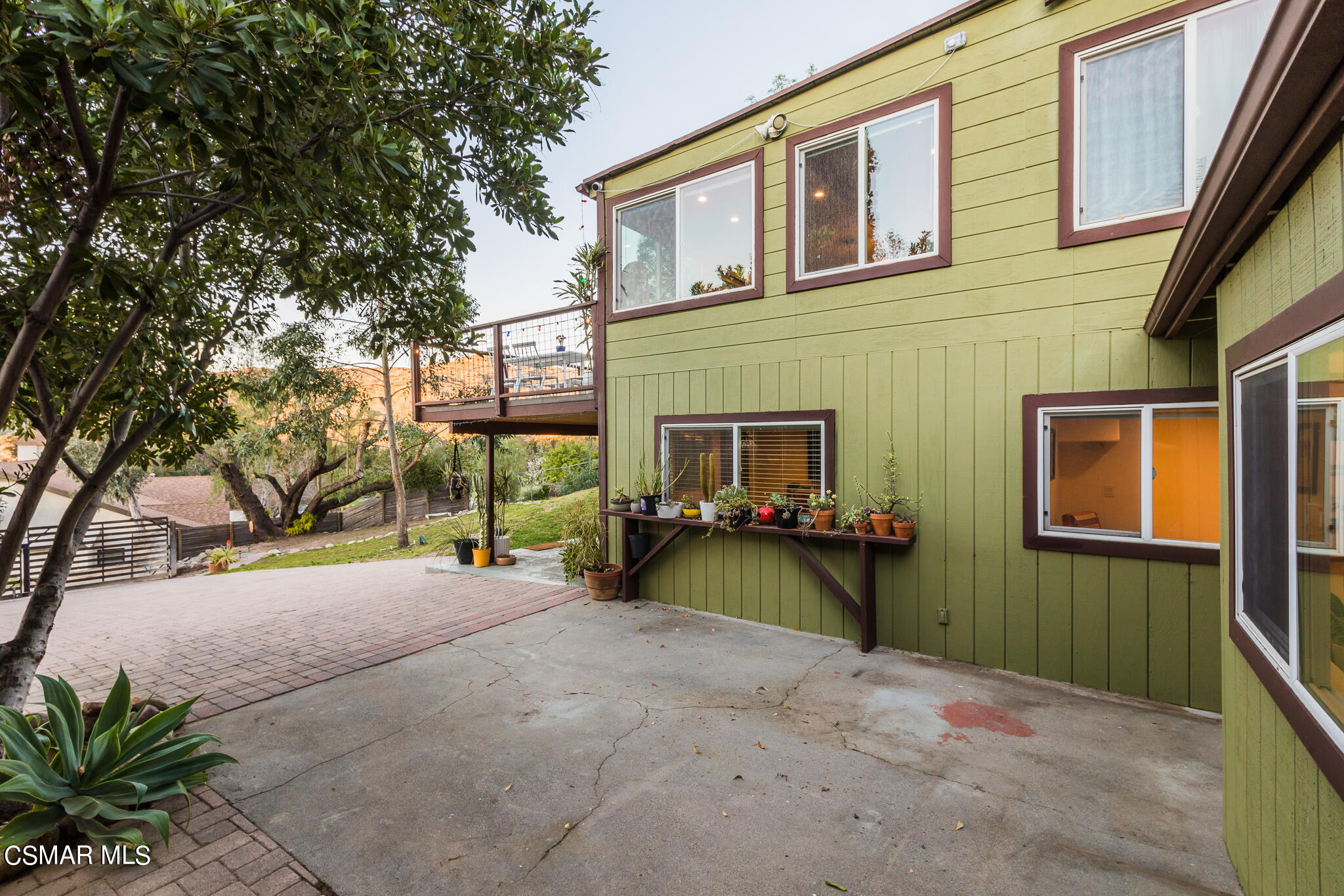 6695 Clear Springs Road Simi Valley, CA 93063 - Photo 82 of 94 a view of a house with a yard and garage