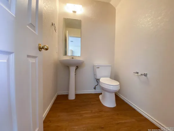 a bathroom with a toilet and a sink