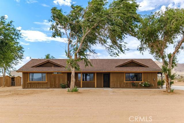 15532 Japatul Road Apple Valley, CA 92307 - Photo 1 of 1 a front view of a house with a yard