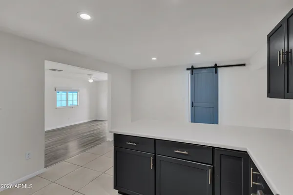a kitchen with a sink and refrigerator