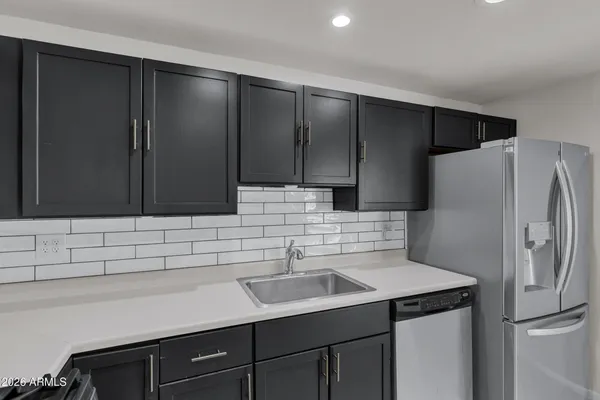 a utility room with cabinets