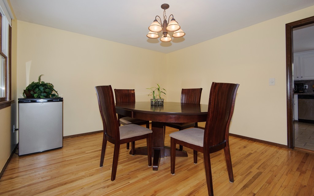 110 Garrison Road Chelmsford, MA 01824 - Photo 3 of 12 a view of a dining room with furniture and wooden floor