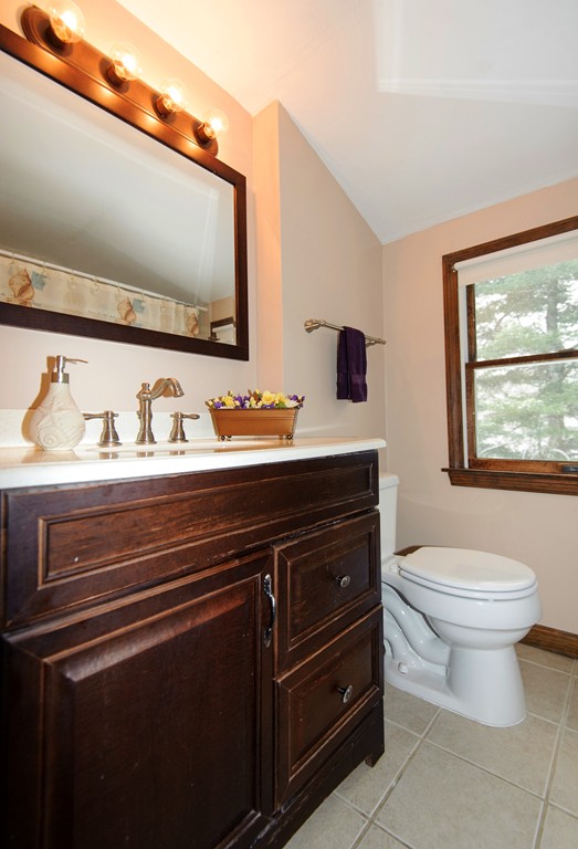 110 Garrison Road Chelmsford, MA 01824 - Photo 8 of 12 a bathroom with a toilet sink and mirror