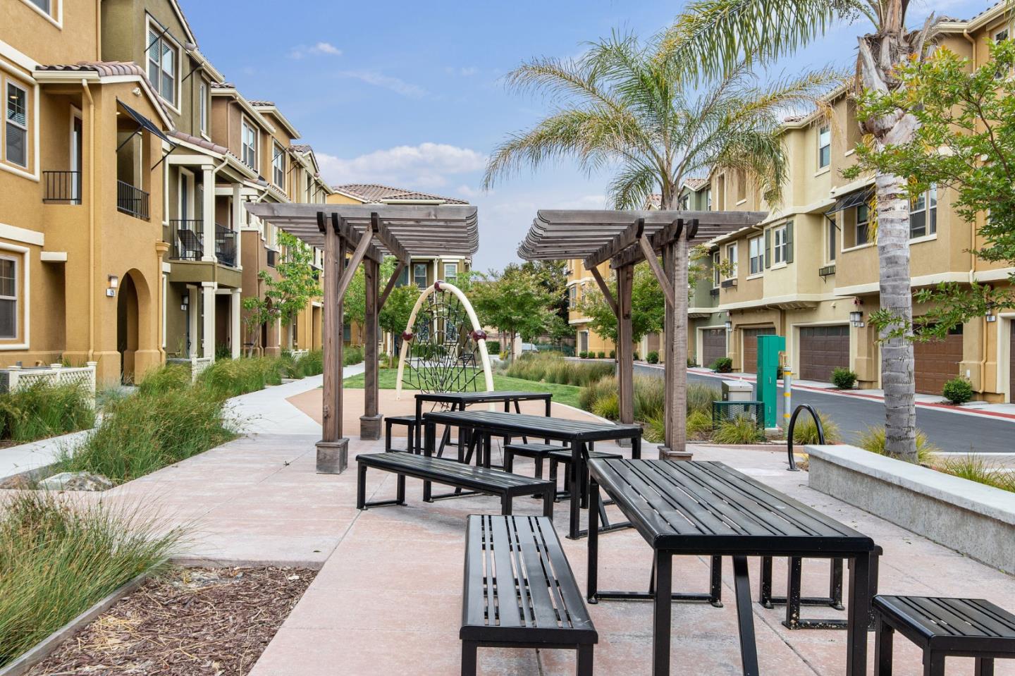 625 Cinnamon Circle Mountain View, CA 94043 - Photo 5 of 7 a view of a patio with table and chairs and potted plants