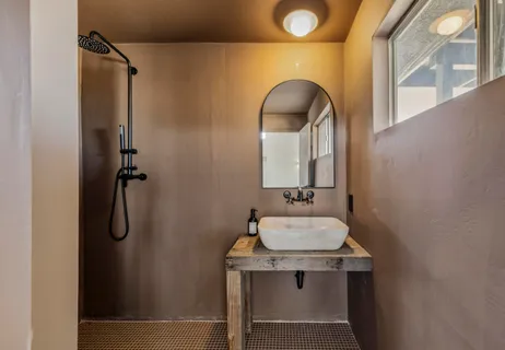 a bathroom with a sink and mirror