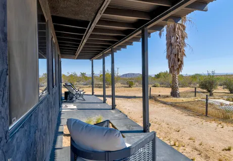 a view of swimming pool with a lounge chair