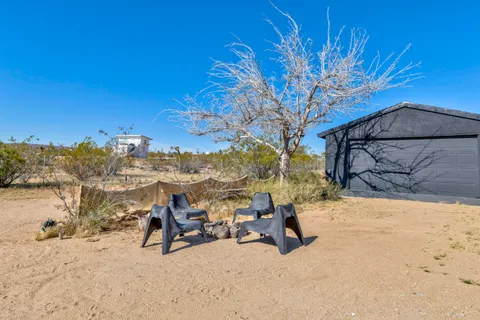 a view of a backyard of the house