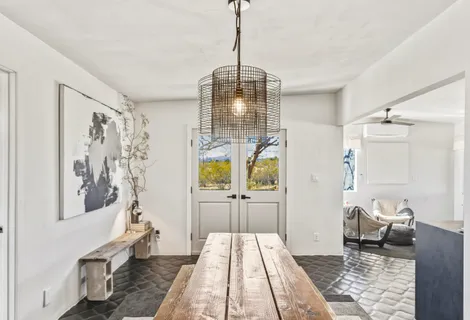 a room with a couch and wooden floor