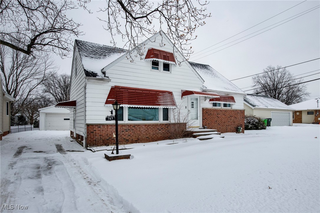 767 Glenhurst Road Willowick, OH 44095 - Photo 1 of 42 View of front of property featuring a garage and an outbuilding