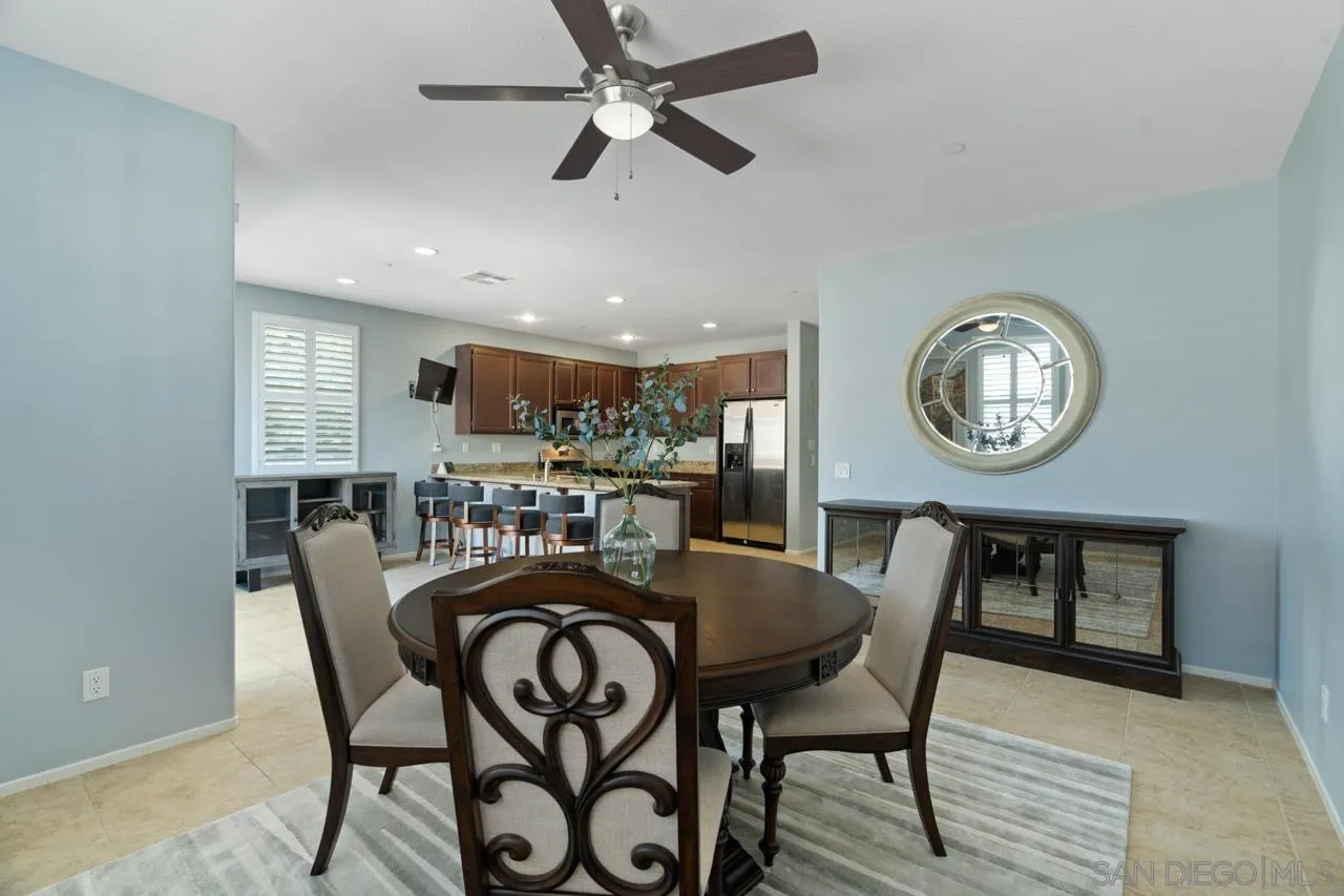 9811 Old Tree Lane Santee, CA 92071 - Photo 19 of 45 a view of a dining room with furniture and a clock