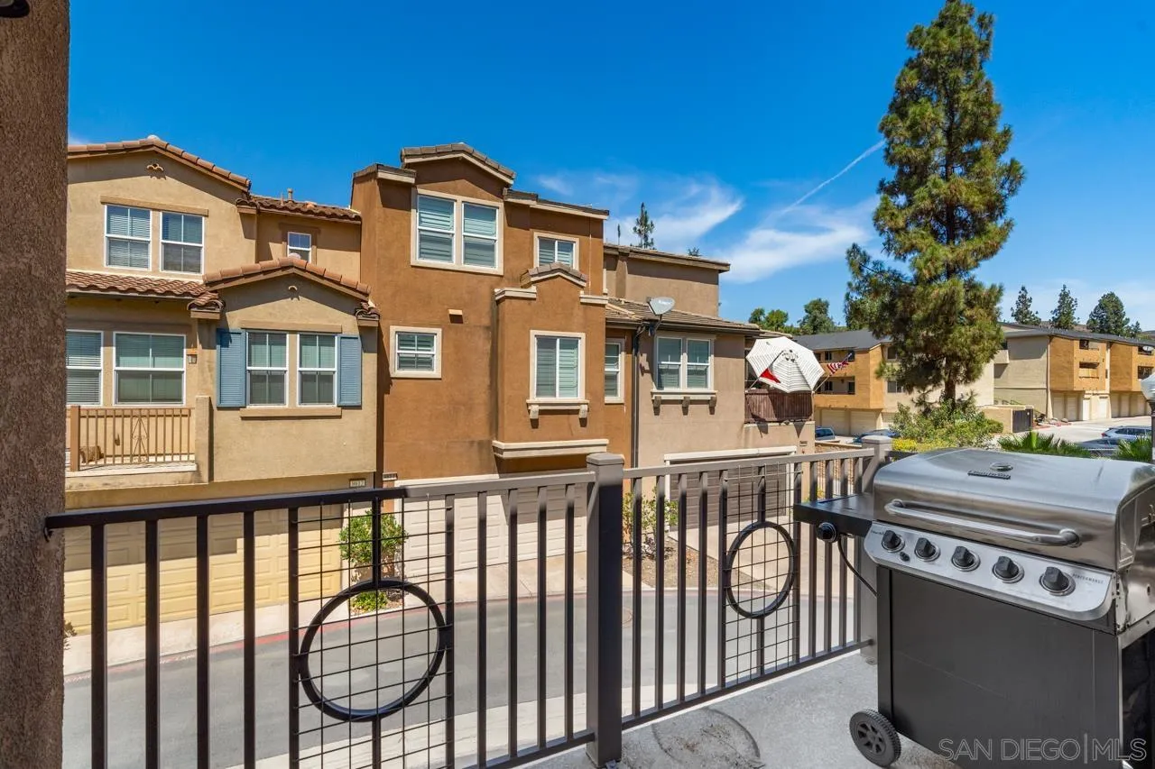 9811 Old Tree Lane Santee, CA 92071 - Photo 20 of 45 a front view of a house with a iron gate