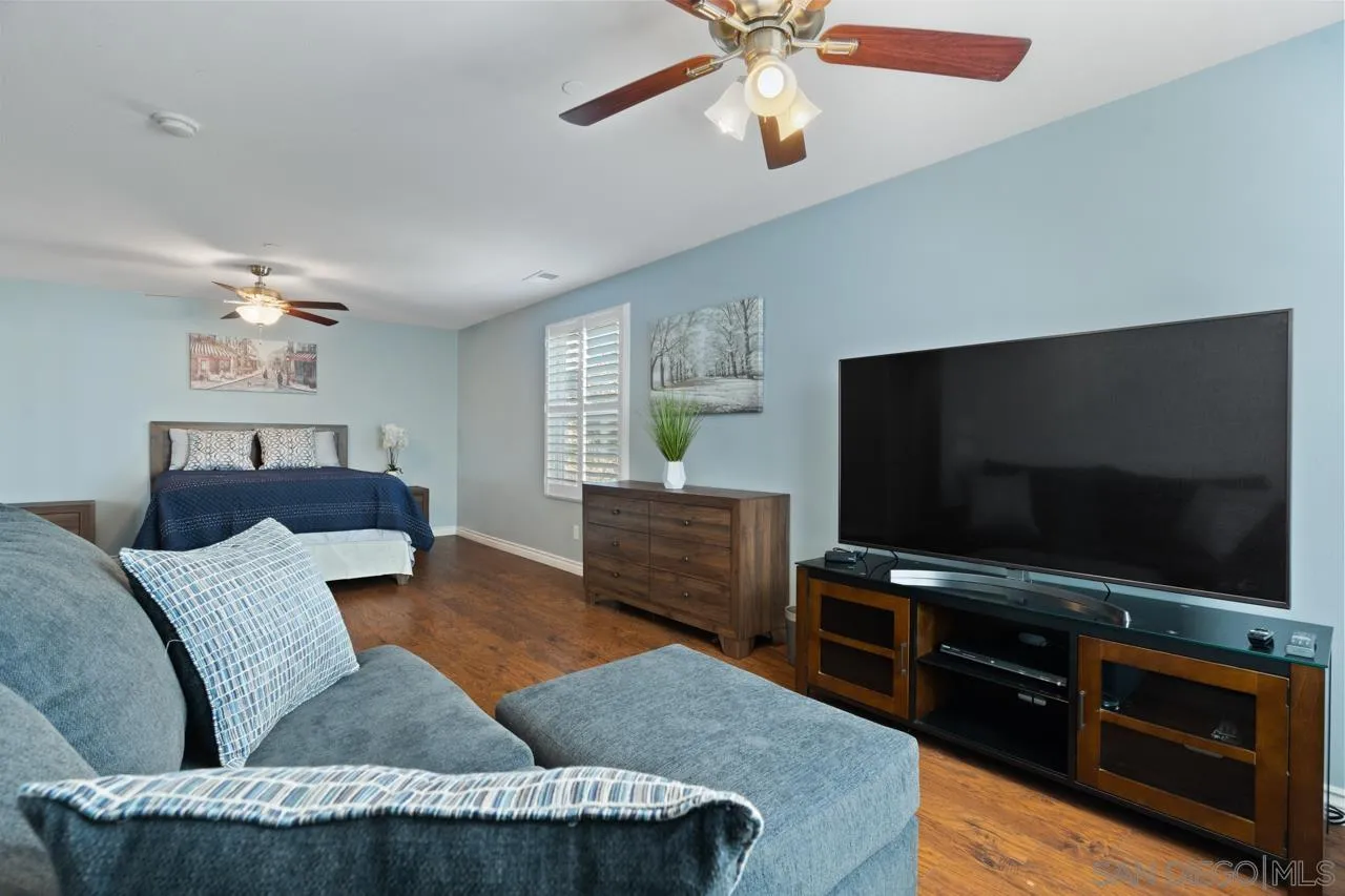 9811 Old Tree Lane Santee, CA 92071 - Photo 31 of 45 a living room with furniture and a flat screen tv
