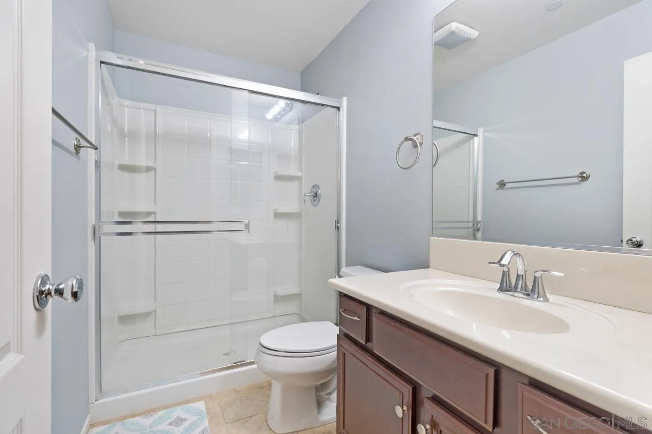9811 Old Tree Lane Santee, CA 92071 - Photo 32 of 45 a bathroom with a sink a toilet and shower