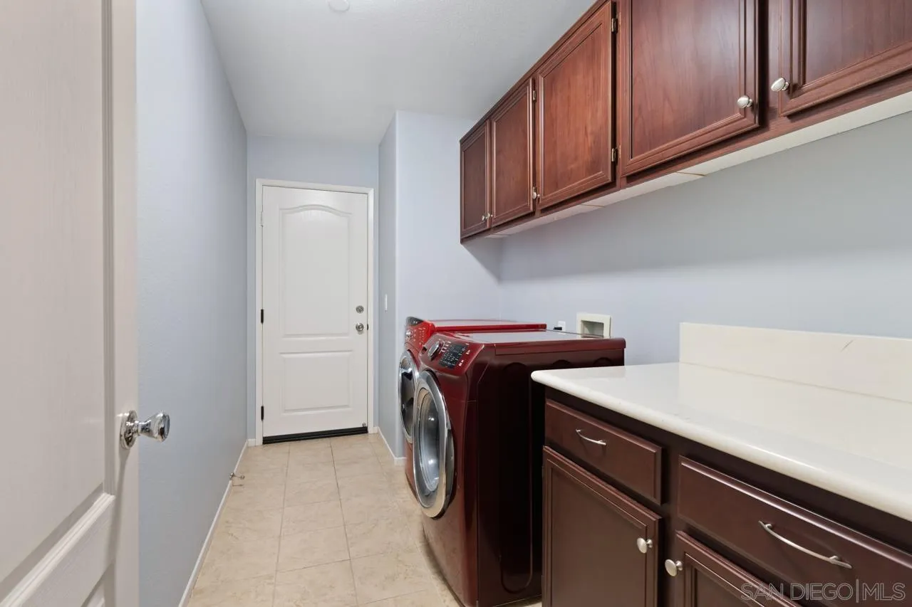 9811 Old Tree Lane Santee, CA 92071 - Photo 33 of 45 a utility room with dryer and washer