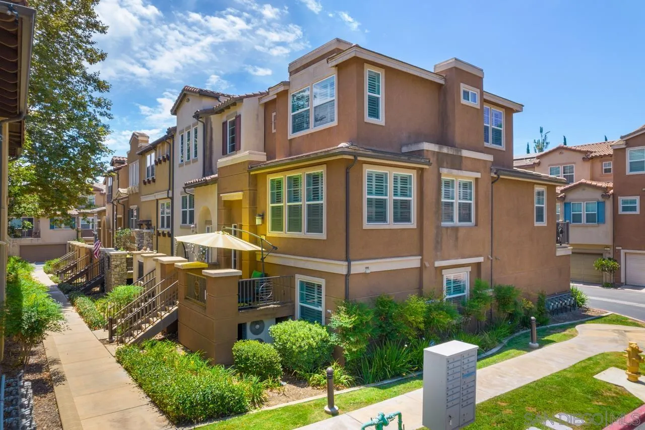 9811 Old Tree Lane Santee, CA 92071 - Photo 35 of 45 a front view of a house with garden and plants