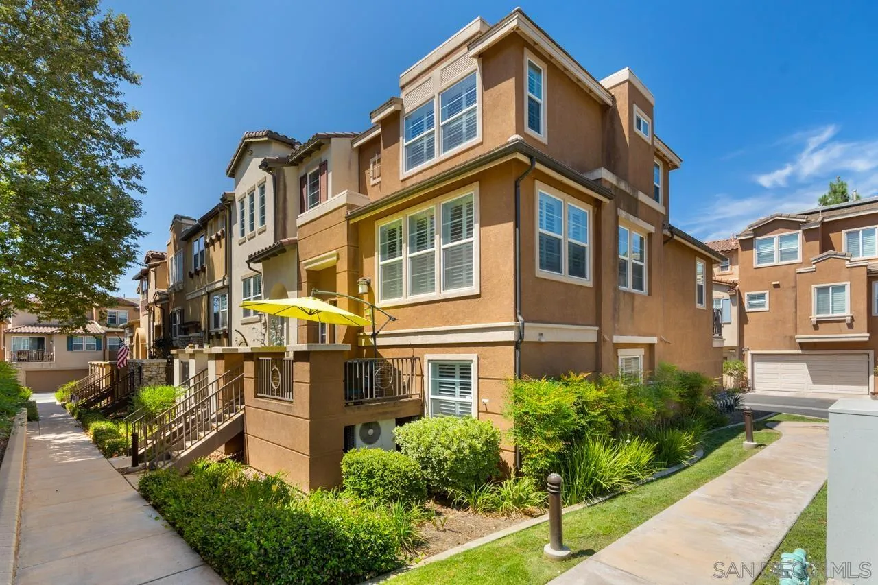 9811 Old Tree Lane Santee, CA 92071 - Photo 4 of 45 a front view of a residential apartment building with a yard