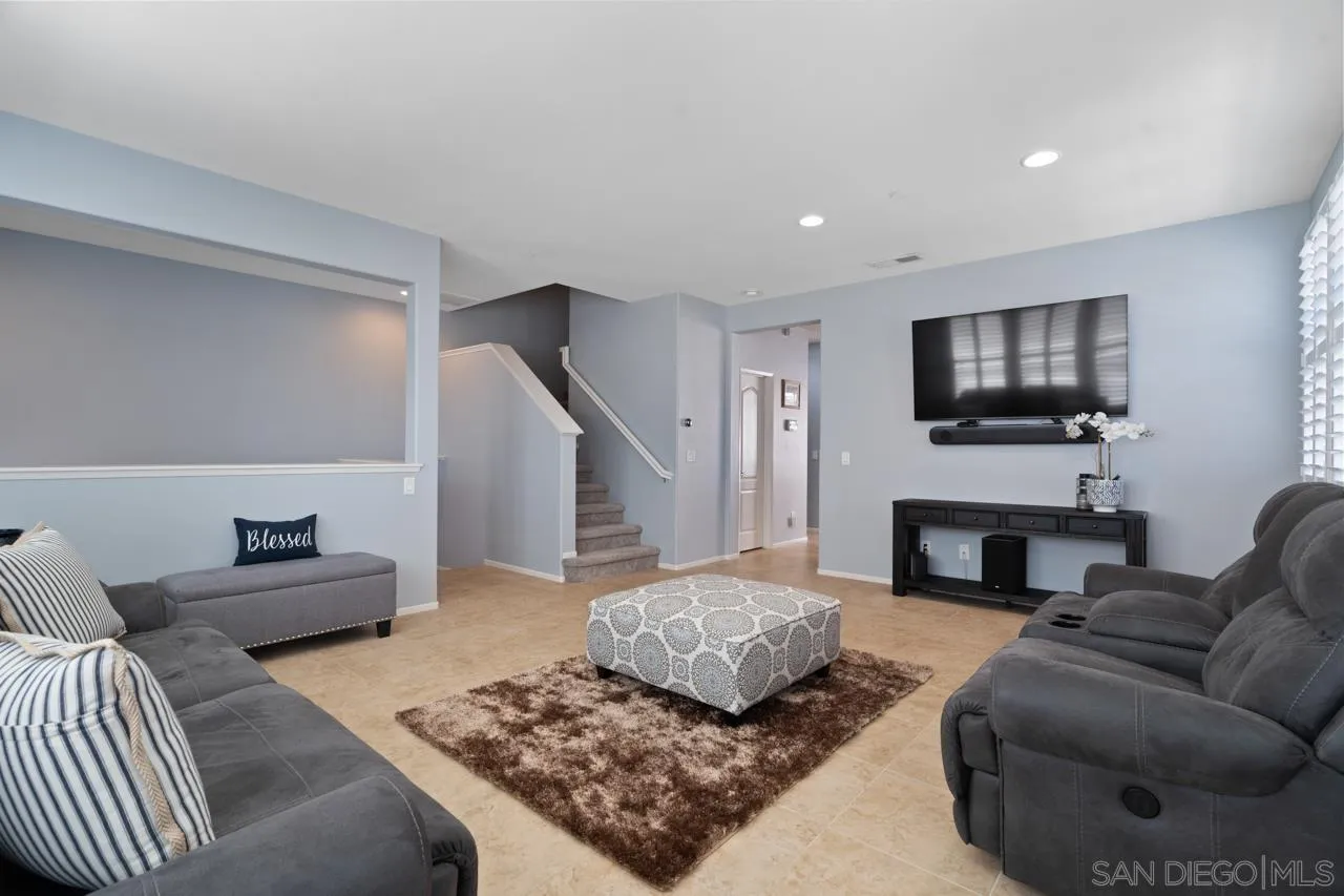 9811 Old Tree Lane Santee, CA 92071 - Photo 8 of 45 a living room with furniture and a fireplace