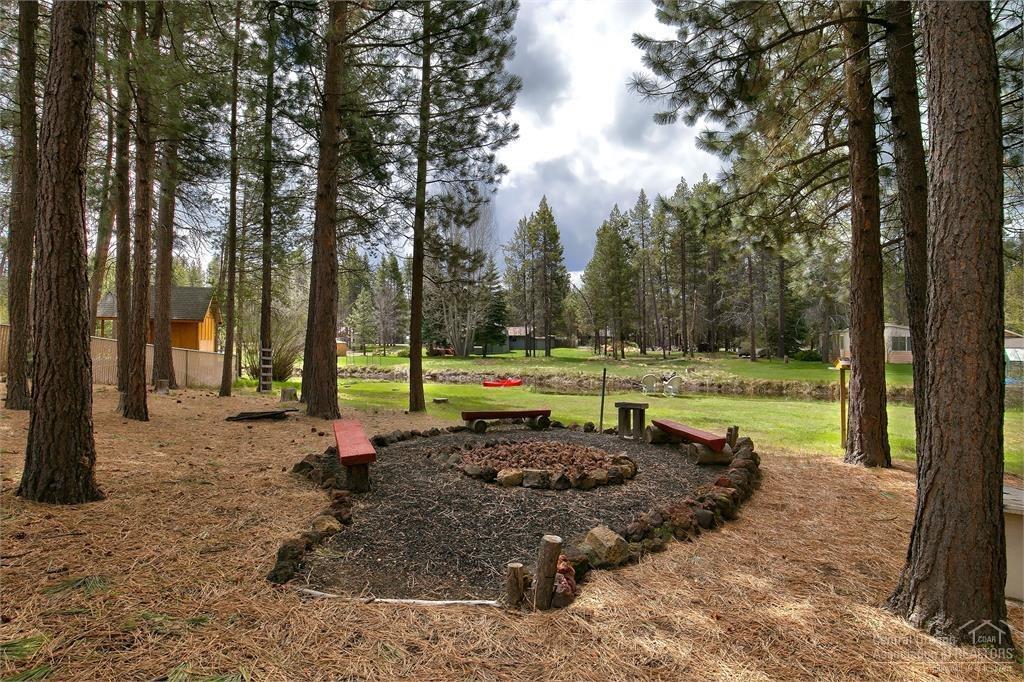 17171 Island Loop Way Bend, OR 97707 - Photo 20 of 25 a view of a park with large trees