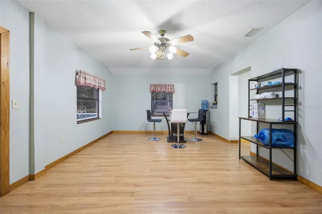 a room with furniture and a wooden floor