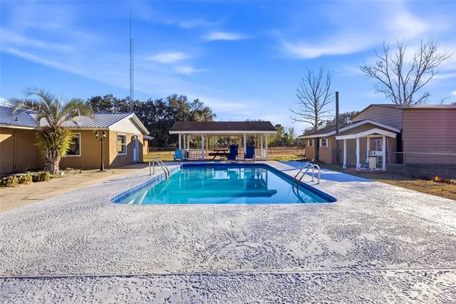 a view of a house with swimming pool
