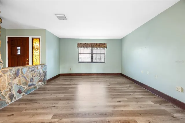 a view of an empty room and window