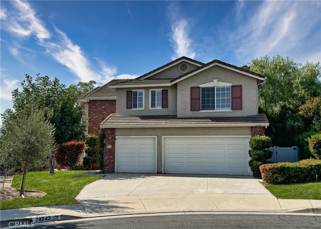 28243 Corte Malbino Temecula, CA 92592 - Photo 1 of 1 a front view of a house with a yard and garage