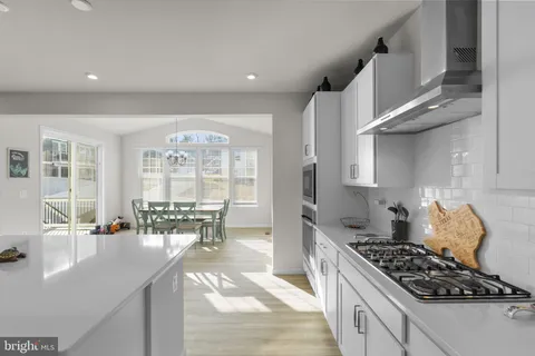 a kitchen with counter top space cabinets and appliances