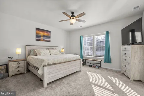 a bathroom with a double vanity sink and mirror