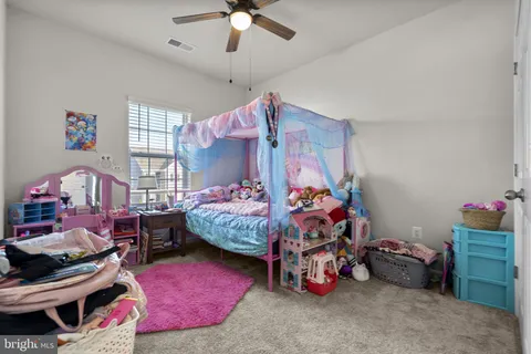 a view of a house with pool and chairs