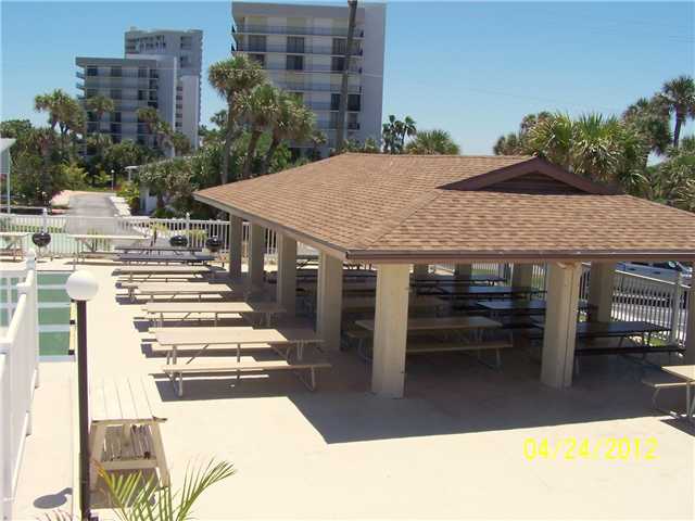 5301 Ebbtide Way Fort Pierce, FL 34949 - Photo 12 of 14 a view of a patio with a table and chairs