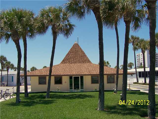 5301 Ebbtide Way Fort Pierce, FL 34949 - Photo 13 of 14 a front view of a house with garden