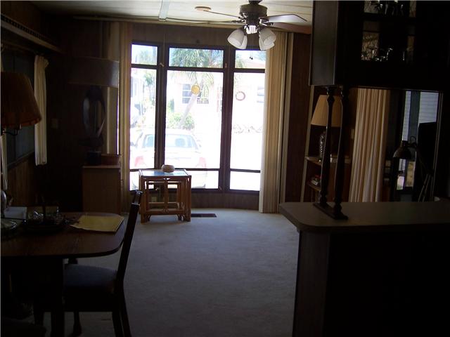 5301 Ebbtide Way Fort Pierce, FL 34949 - Photo 6 of 14 a living room with furniture and a floor to ceiling window