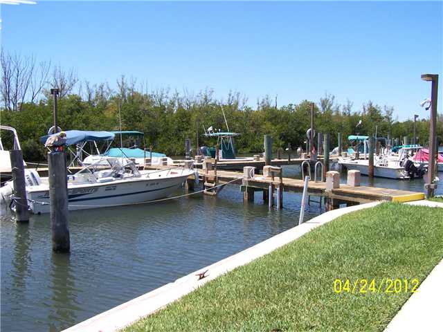 5301 Ebbtide Way Fort Pierce, FL 34949 - Photo 10 of 14 a view of swimming pool with outdoor seating and lake view