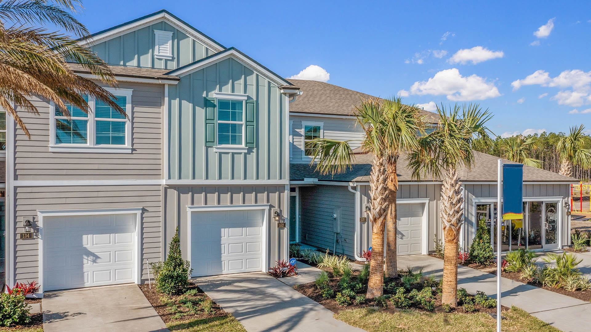 61 Redbud Road Palm Coast, FL 32137 - Photo 1 of 39 a front view of a house with a yard