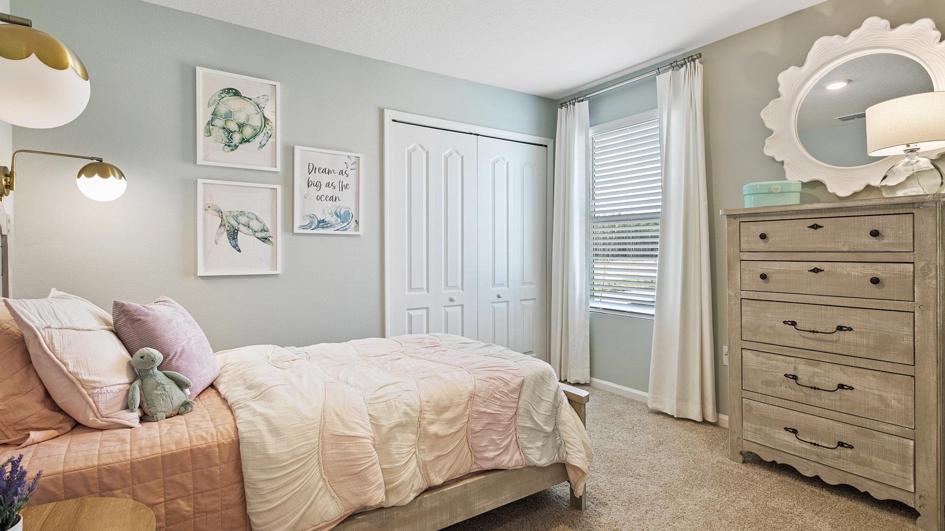 61 Redbud Road Palm Coast, FL 32137 - Photo 24 of 39 a bedroom with a bed and cabinets