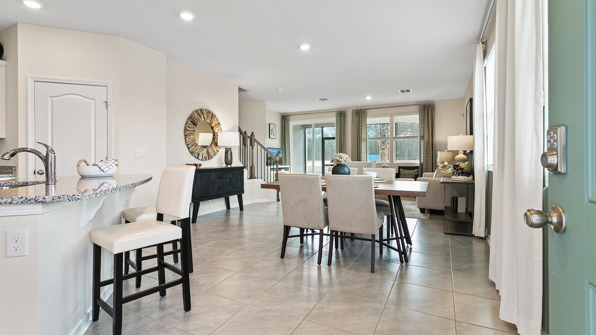 61 Redbud Road Palm Coast, FL 32137 - Photo 4 of 39 a view of a dining room with furniture and a large window