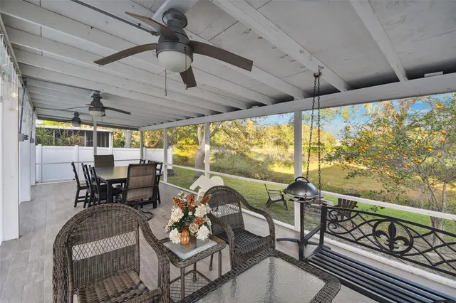a view of a patio with table and chairs