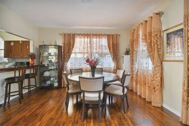 a living room with a flat screen tv and a fireplace
