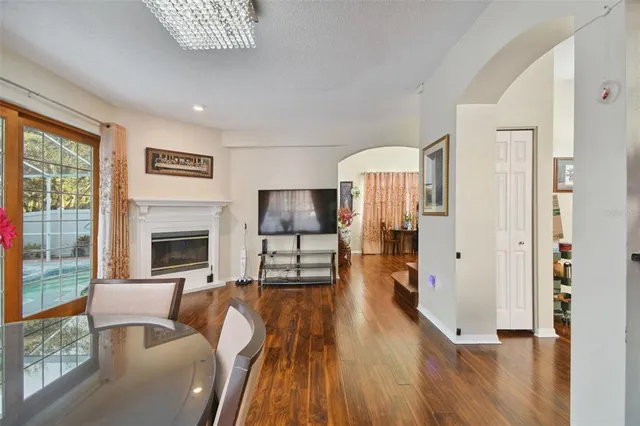 a view of a dining room with furniture and wooden floor