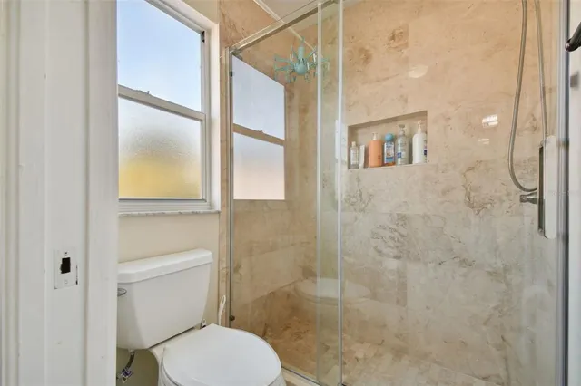 an aerial view of residential building and lake