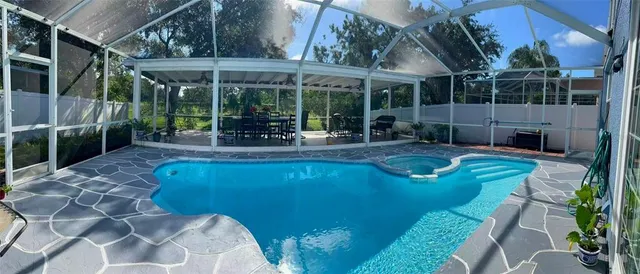 a view of a chairs and table in patio
