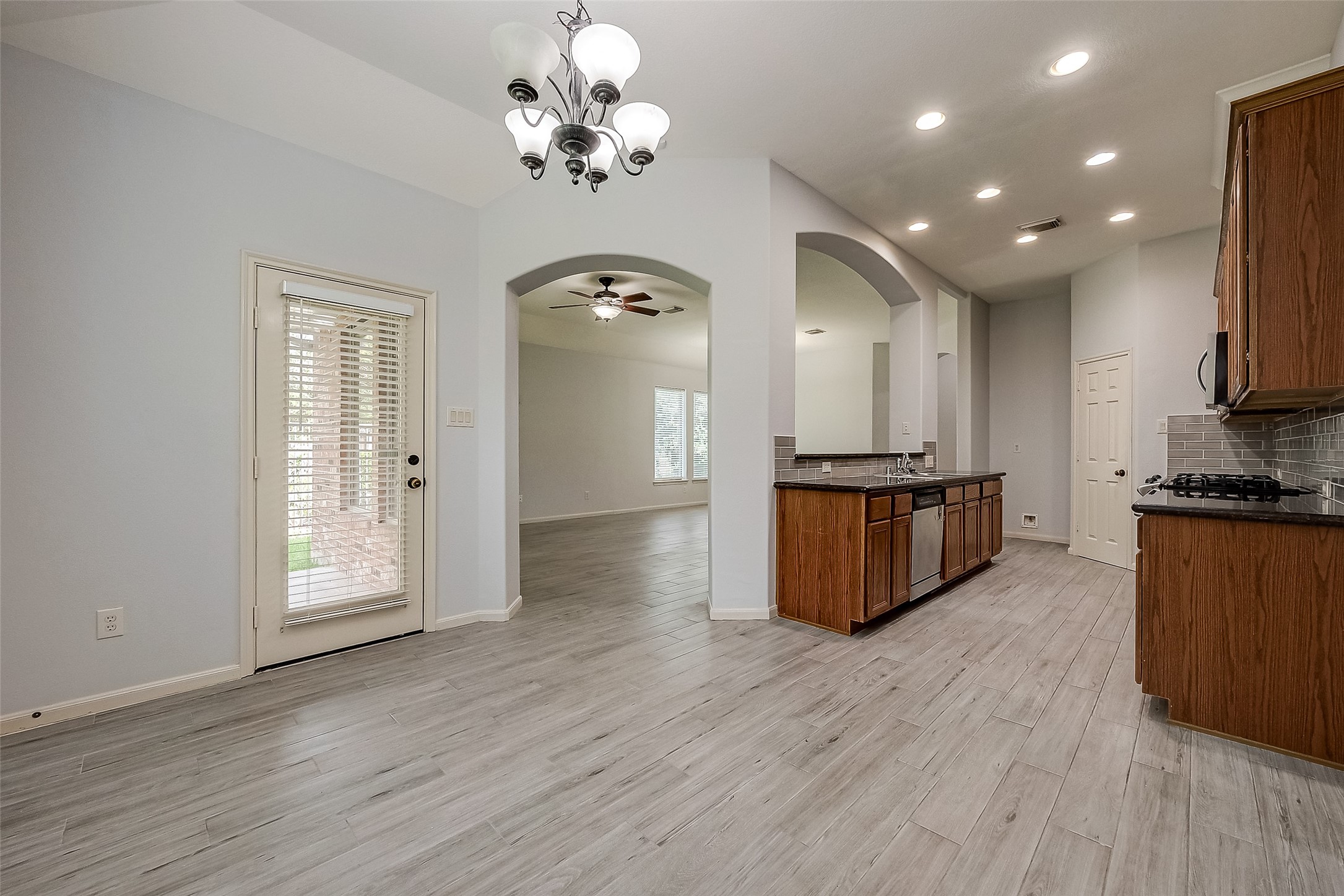 18302 North Elizabeth Shore Loop Cypress, TX 77433 - Photo 13 of 41 a view of kitchen with sink microwave and cabinets